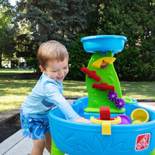 Kids' splash water table with red sprayer and yellow funnel attachment