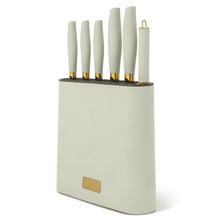 Mint green knife block set with white knives in slots and gold base ring