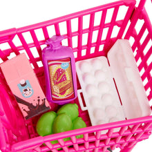 Pink cart basket with toy milk, snack, eggs and green produce