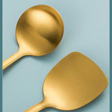 Golden stainless steel ladle with rounded bowl and long handle.