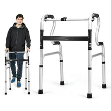 Medical mobility walker with black grips and arm supports, silver frame beside person.