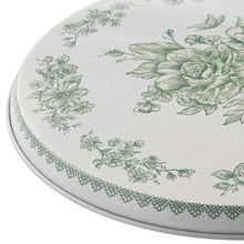 Round burner cover with green floral design and scalloped lace-style edge trim