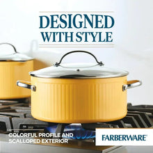 Yellow nonstick stockpot with matching lid on a stovetop