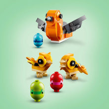 LEGO Bird's Nest 40639 build with orange and yellow birds, gray wings, and eggs