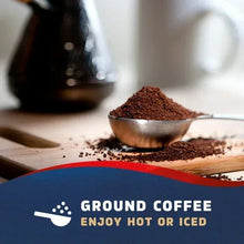 Dark-roast ground coffee on spoon with Seattle’s Best Coffee bag