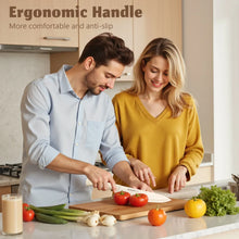 Kitchen knives with white handles being used on a wooden cutting board with produce