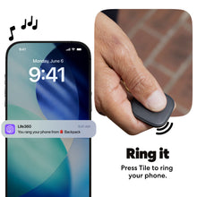 Black slim Tile Bluetooth tracker held between fingers