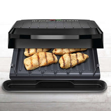 George Foreman grill and panini maker open, ridged plates with grilled food