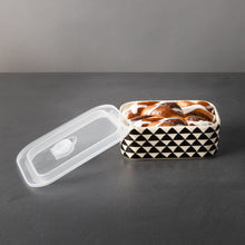 Rectangle ceramic baking dish with black-and-white triangle pattern and lid open