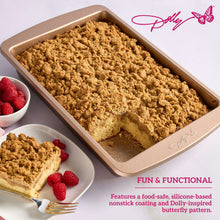 Non-stick cake pan filled with baked dessert, embossed butterfly base, rose-gold.