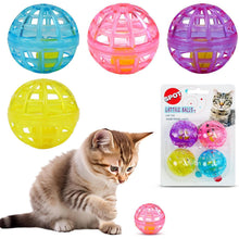 Cat with assorted lattice bell balls in blue, pink, purple, and yellow