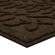 Brown leaf-vine doormat corner view with textured top and backing edge