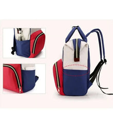 Blue and red diaper backpack with side zipper pocket and crossbody strap