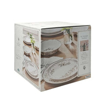 Boxed 12-piece stoneware dinnerware set with floral plates and bowls