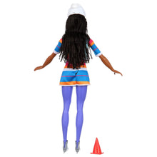 Ice skating fashion doll back view with long black hair, striped dress, and skates