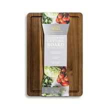Acacia wood cutting board in clear packaging with protective outer frame