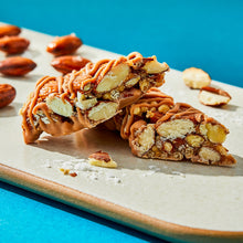 Caramel almond & sea salt nut bar pieces with chocolate drizzle