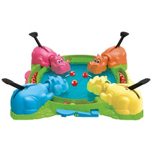Hungry Hungry Hippos board game tray with four colorful hippos and red marble pieces