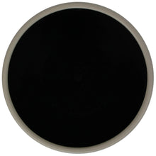 Medium round resin planter in dark color, top opening visible