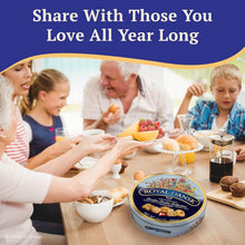 Royal Dansk cookie tin on a table with a family sharing snacks