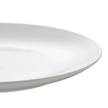 White glazed plate edge close-up, smooth curved rim