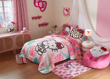 Hello Kitty plush table lamp with white cat face and pink bow on the shade