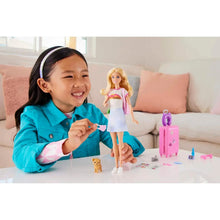 Travel doll set with blonde doll, pink suitcase, puppy figure, and small accessories