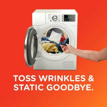 Front-load dryer window with laundry and a hand placing dryer sheets