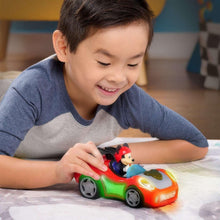 Red and green toy car with Mickey driver and glowing lights during play