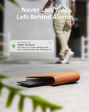 Black eufy Security smart tracker card on floor