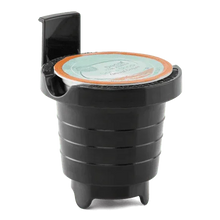 Black matte single-serve coffee maker pod holder with a pod inserted