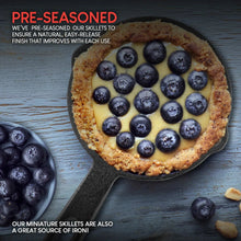 Mini cast iron skillet with baked dessert topped with blueberries