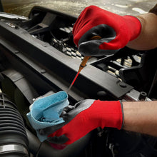 Red nitrile-coated work gloves on hands with dark coated palms