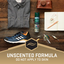 Repel permethrin clothing and gear spray can beside a dark button-up shirt and shoes