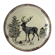 Round stoneware dinner plate with elk and pine trees plus cabin illustration in taupe