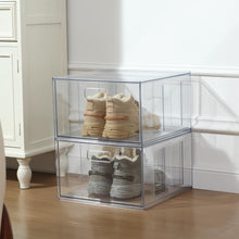Clear plastic closet drawer with pull handle, holding sneakers and shoes