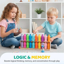Kids playing a color matching memory board game with multicolor bottle pieces