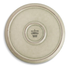 Ceramic dinner plate back, sand-toned finish with center brand mark