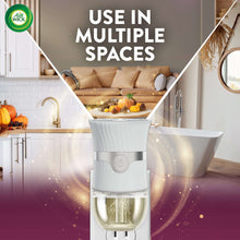 Air Wick plug-in scented oil warmer unit with clear refill container