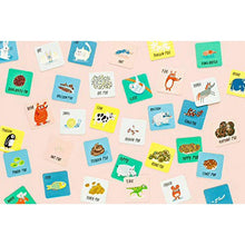 Animal-themed matching and memory game card set spread with cartoon creatures
