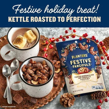 Cashew snack bag with festive label beside a bowl of cashews and a hot cocoa drink