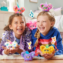 Rainbow and pink mini electronic plush toys held by two laughing kids