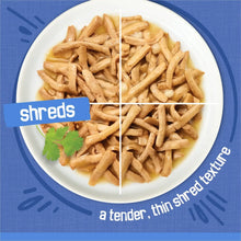 Wet cat food shreds in gravy texture in a bowl, thin shredded pieces