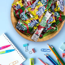 Assorted fruit snack wrappers in a wooden tray