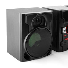 Left speaker of black stereo system with textured grille