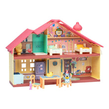 Toy playset house exterior view with open rooms and small furniture pieces
