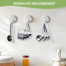 Hanging stainless steel measuring spoons and cups with ring loops for storage