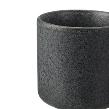 Dark gray stoneware mug body with speckled finish and wide open rim.