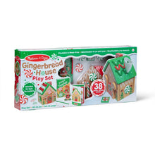 Wooden gingerbread house play set in a box, showing house parts and number 38