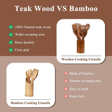 Wooden cooking utensils in cup holder, assorted spoon and fork shaped heads.